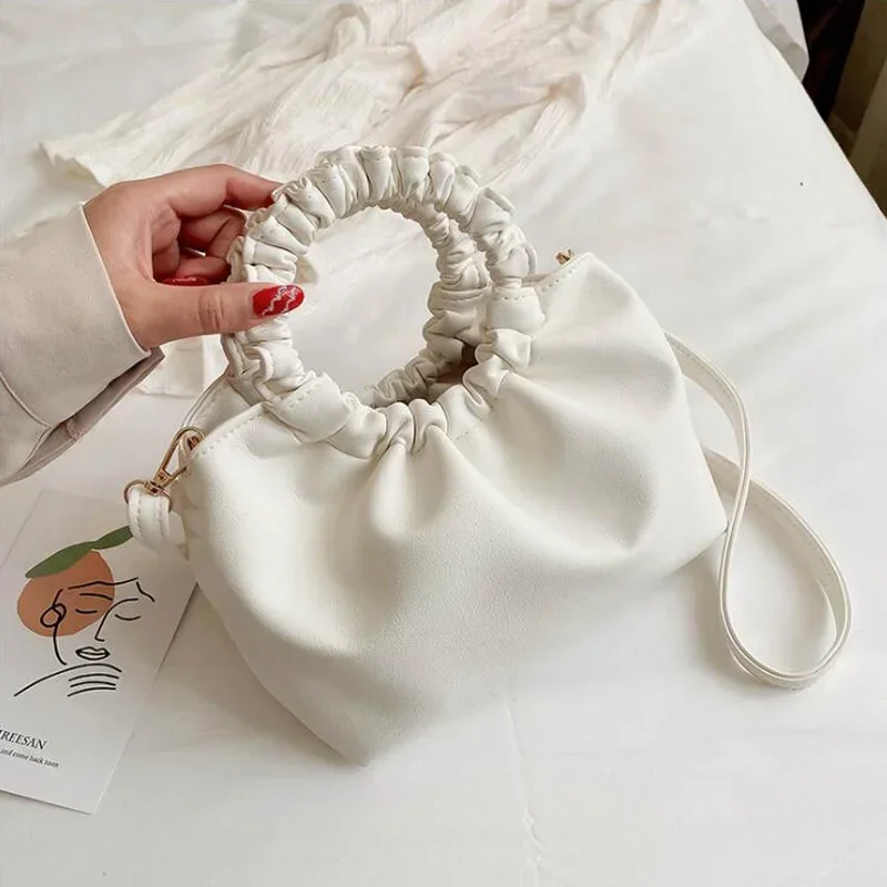 Małe torebki damskie z plisowa – Key Holder Leather Pouch recenzja i cena